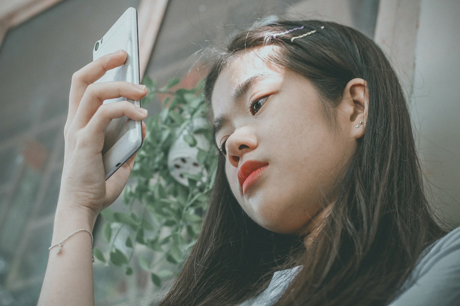 woman holding smartphone outside